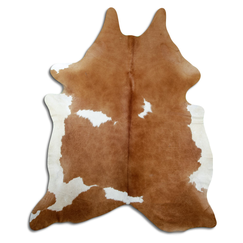 Brown and white cowhide rug of about 220 × 190 cm, seen from above: the exact hide you receive