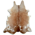 Brown and white cowhide rug of about 240 × 200 cm, seen from above: the exact hide you receive