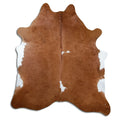 Brown and white cowhide rug of about 210 × 190 cm, seen from above: the exact hide you receive