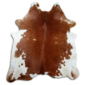 Brown and white cowhide rug of about 190 × 180 cm, seen from above: the exact hide you receive