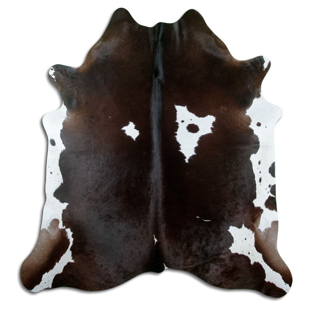Brown and white cowhide rug of about 200 × 190 cm, seen from above: the exact hide you receive
