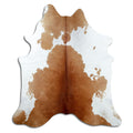 Brown and white cowhide rug of about 210 × 190 cm, seen from above: the exact hide you receive