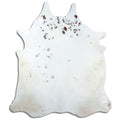 Brown and white cowhide rug of about 230 × 200 cm, seen from above: the exact hide you receive