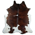 Brown and white cowhide rug of about 240 × 220 cm, seen from above: the exact hide you receive