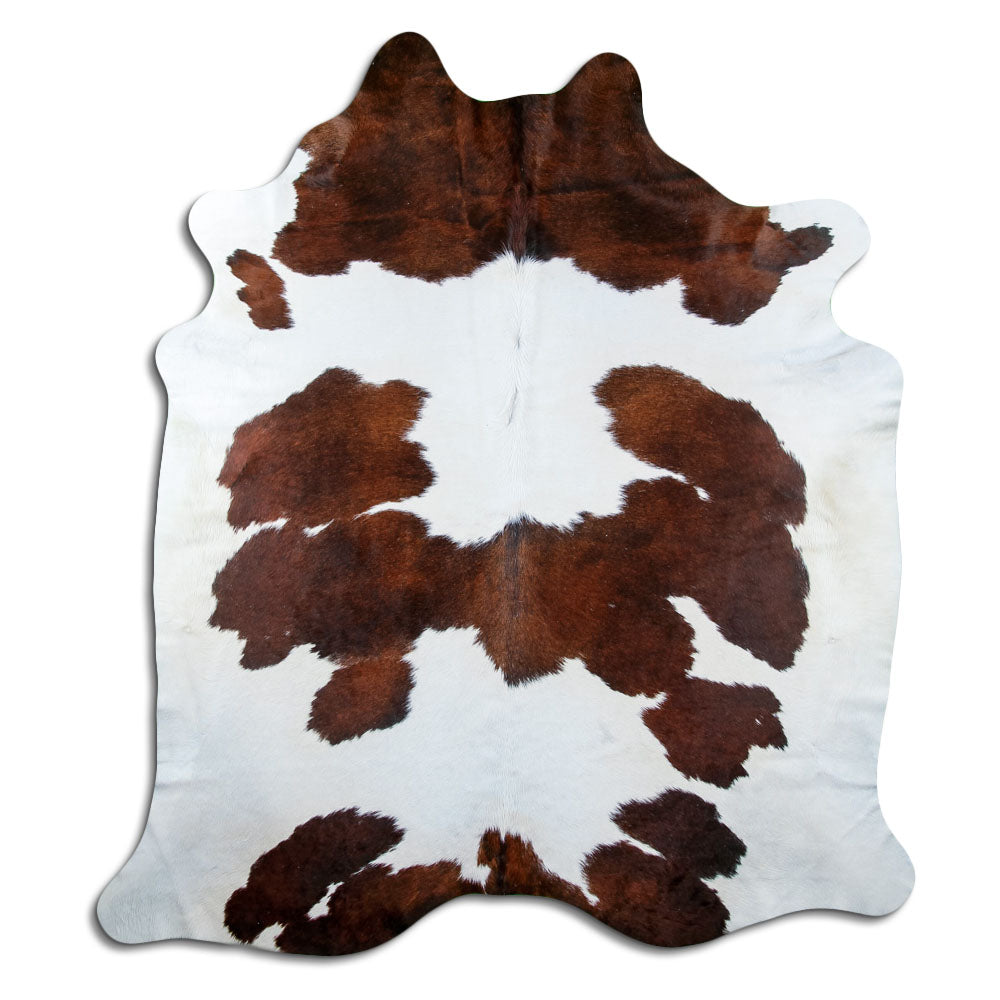 Brown and white cowhide rug of about 230 × 200 cm, seen from above: the exact hide you receive