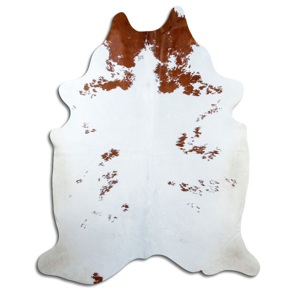 Brown and white cowhide rug of about 220 × 180 cm, seen from above: the exact hide you receive