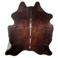 Brown and white cowhide rug of about 200 × 170 cm, seen from above: the exact hide you receive