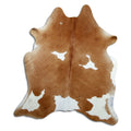 Brown and white cowhide rug of about 190 × 170 cm, seen from above: the exact hide you receive