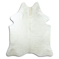 Champagne cowhide rug of about 190 × 160 cm, seen from above: the exact hide you receive