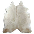 Champagne cowhide rug of about 190 × 170 cm, seen from above: the exact hide you receive