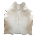 Champagne cowhide rug of about 160 × 140 cm, seen from above: the exact hide you receive