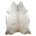 Champagne cowhide rug of about 210 × 160 cm, seen from above: the exact hide you receive