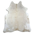 Champagne cowhide rug of about 200 × 170 cm, seen from above: the exact hide you receive