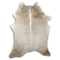 Champagne cowhide rug of about 190 × 140 cm, seen from above: the exact hide you receive