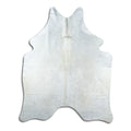 Champagne cowhide rug of about 190 × 150 cm, seen from above: the exact hide you receive