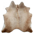 Champagne cowhide rug of about 170 × 170 cm, seen from above: the exact hide you receive