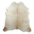 Champagne cowhide rug of about 170 × 160 cm, seen from above: the exact hide you receive