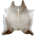 Champagne cowhide rug of about 210 × 190 cm, seen from above: the exact hide you receive