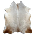Champagne cowhide rug of about 210 × 190 cm, seen from above: the exact hide you receive