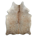 Champagne cowhide rug of about 180 × 130 cm, seen from above: the exact hide you receive