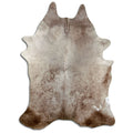 Champagne cowhide rug of about 240 × 180 cm, seen from above: the exact hide you receive
