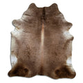 Champagne cowhide rug of about 220 × 200 cm, seen from above: the exact hide you receive