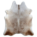 Champagne cowhide rug of about 220 × 190 cm, seen from above: the exact hide you receive