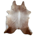 Champagne cowhide rug of about 240 × 200 cm, seen from above: the exact hide you receive