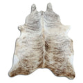 Brindle cowhide rug of about 190 × 170 cm, seen from above: the exact hide you receive
