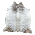 Brindle cowhide rug of about 190 × 180 cm, seen from above: the exact hide you receive