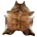 Brindle cowhide rug of about 220 × 210 cm, seen from above: the exact hide you receive