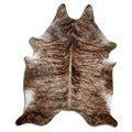 Brindle cowhide rug of about 220 × 180 cm, seen from above: the exact hide you receive