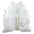 Brindle cowhide rug of about 210 × 190 cm, seen from above: the exact hide you receive