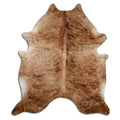 Brindle cowhide rug of about 220 × 190 cm, seen from above: the exact hide you receive