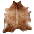 Brindle cowhide rug of about 250 × 220 cm, seen from above: the exact hide you receive