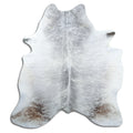 Grey cowhide rug of about 200 × 180 cm, seen from above: the exact hide you receive