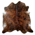 Brindle cowhide rug of about 180 × 180 cm, seen from above: the exact hide you receive