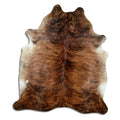 Brindle cowhide rug of about 220 × 190 cm, seen from above: the exact hide you receive