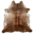 Brindle cowhide rug of about 210 × 190 cm, seen from above: the exact hide you receive
