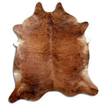Brindle cowhide rug of about 230 × 200 cm, seen from above: the exact hide you receive