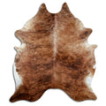 Brindle cowhide rug of about 230 × 200 cm, seen from above: the exact hide you receive