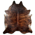 Brindle cowhide rug of about 230 × 210 cm, seen from above: the exact hide you receive