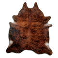 Brindle cowhide rug of about 210 × 180 cm, seen from above: the exact hide you receive