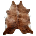 Brindle cowhide rug of about 240 × 210 cm, seen from above: the exact hide you receive