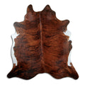 Brindle cowhide rug of about 210 × 200 cm, seen from above: the exact hide you receive
