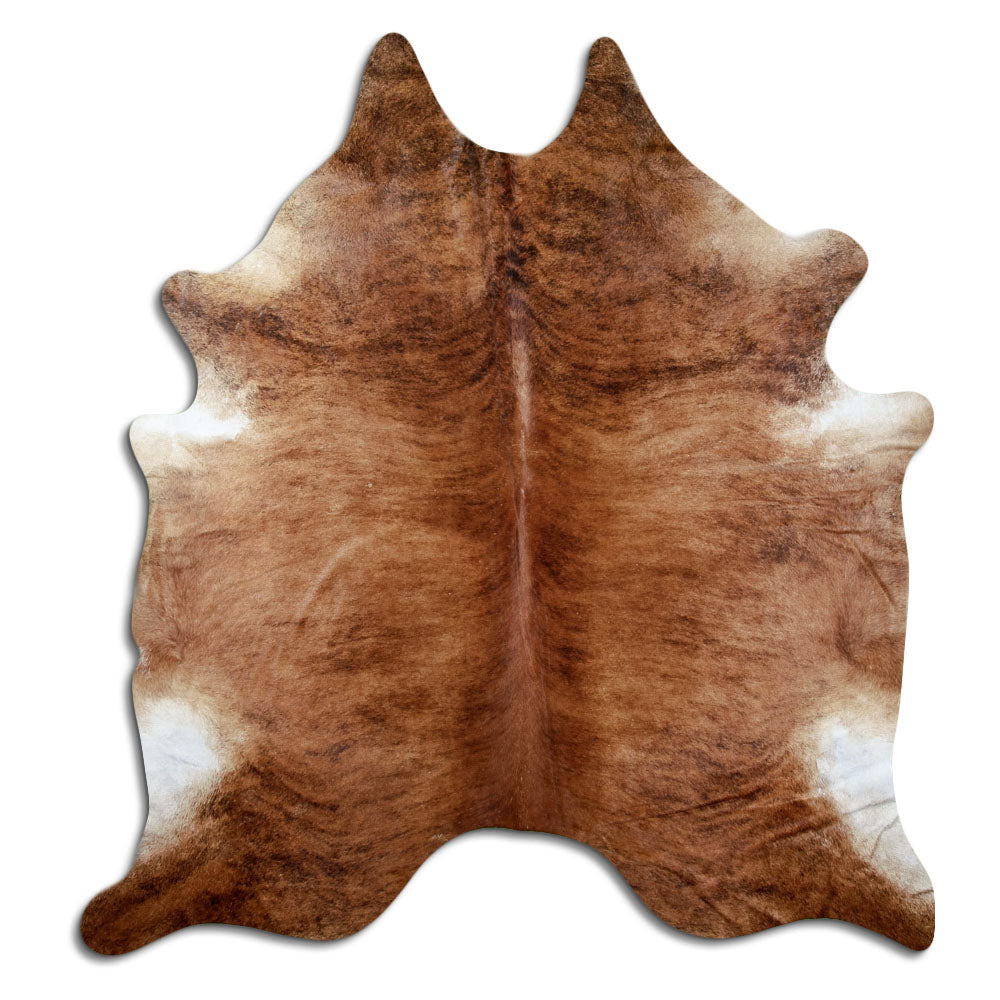 Brindle cowhide rug of about 240 × 220 cm, seen from above: the exact hide you receive