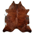Brindle cowhide rug of about 210 × 190 cm, seen from above: the exact hide you receive