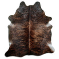 Brindle cowhide rug of about 210 × 180 cm, seen from above: the exact hide you receive