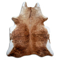 Brindle cowhide rug of about 230 × 190 cm, seen from above: the exact hide you receive