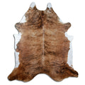 Brindle cowhide rug of about 250 × 220 cm, seen from above: the exact hide you receive